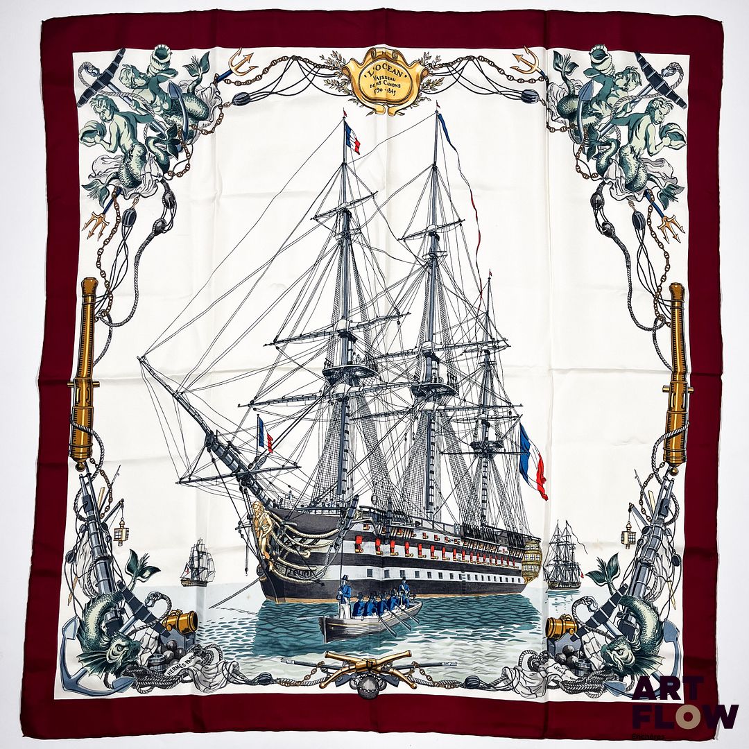 HERMÈS Modèle "L'Océan, vaisseau de 118 canons 1790-1845" Carré en twill de soie d'après Ledoux, à bordure bordeaux. 90 x 90 cm. Bon état général malgré quelques légers défauts.