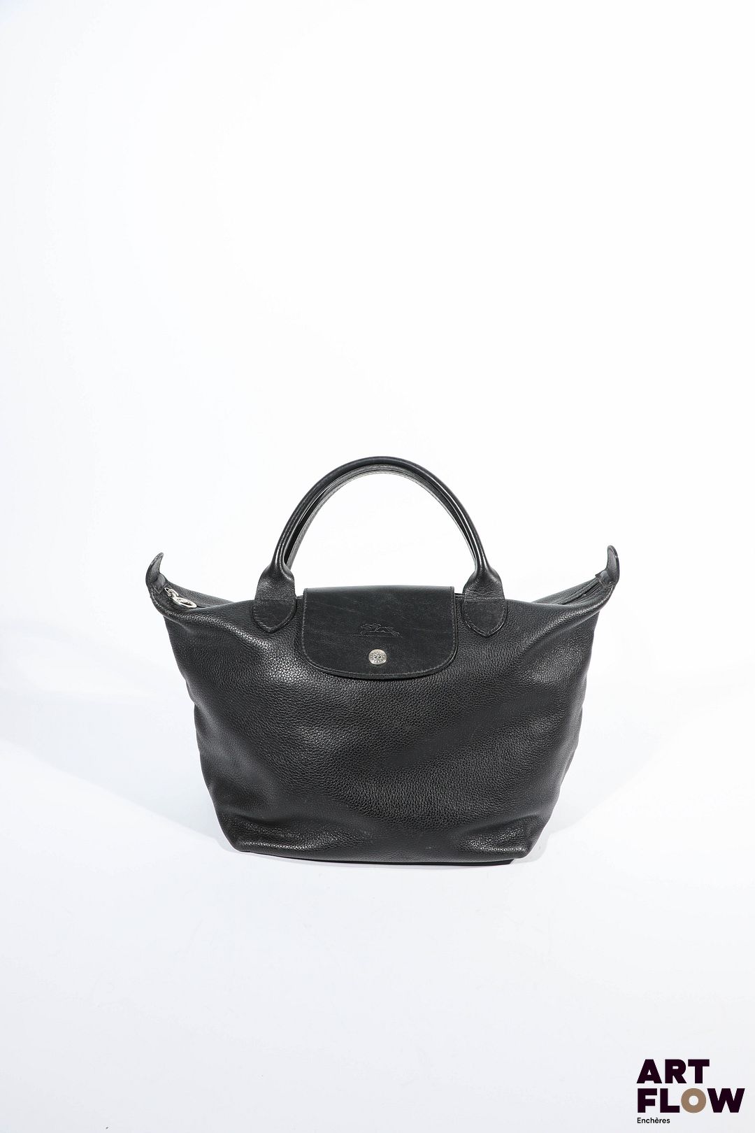 LONGCHAMP Sac à main modèle Le pliage en cuir noir. Dimensions : 25 x 44 cm environ. Griffures, et usures d'usage