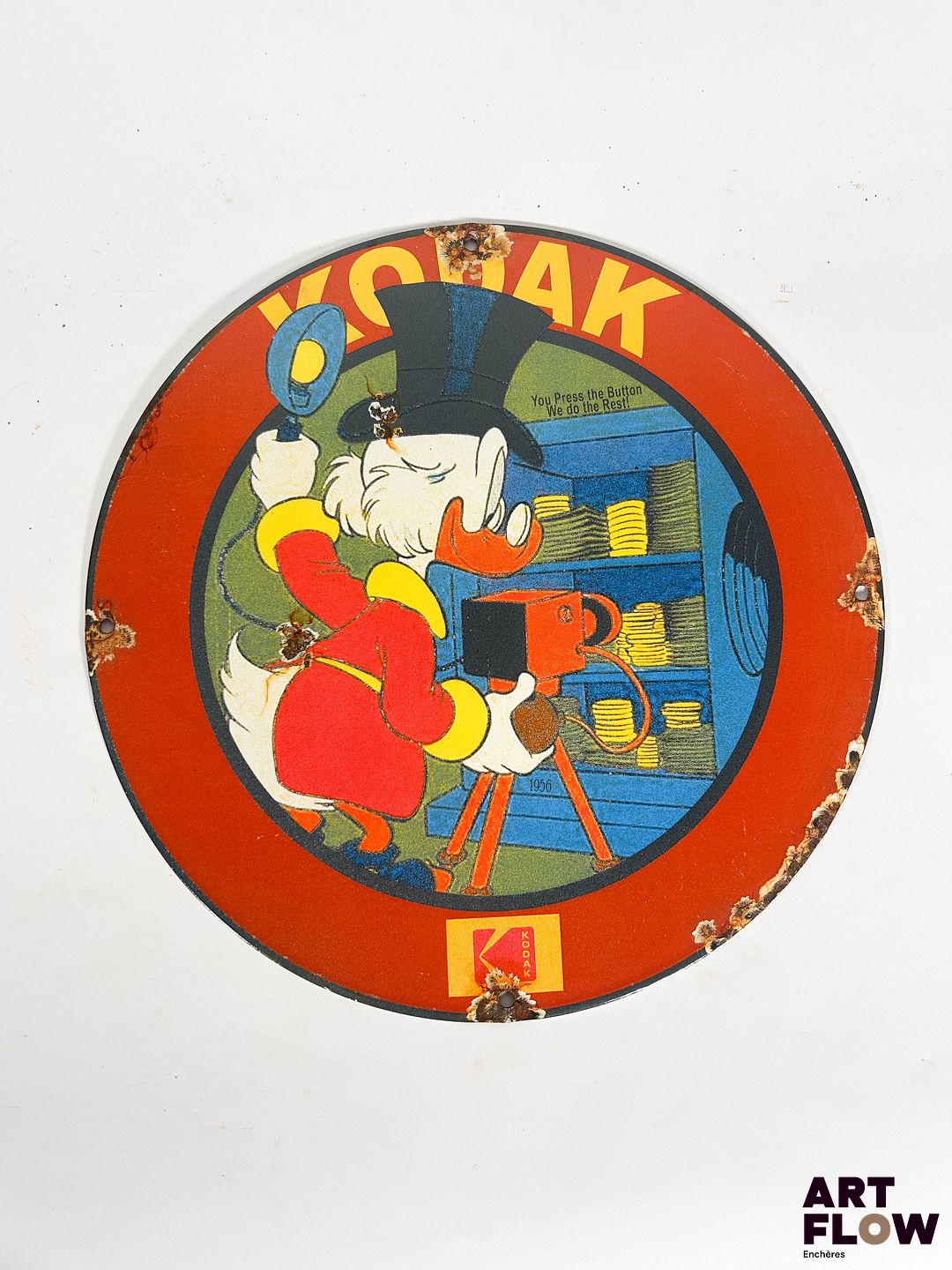Plaque émaillée ronde Kodak représentant Picsou Diamètre : 30 cm Petits éclats et traces de rouille Reproduction moderne