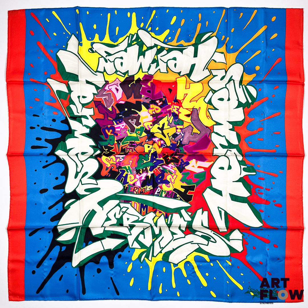 HERMES Modèle "Graff Hermès" x KONGO Edition spéciale et limitée Carré en twill de soie dessiné par Cyril Kongo, sur fond bleu et bordure orange. 90 x 90 cm Dans ses plis d'origine. Edition circa 2011