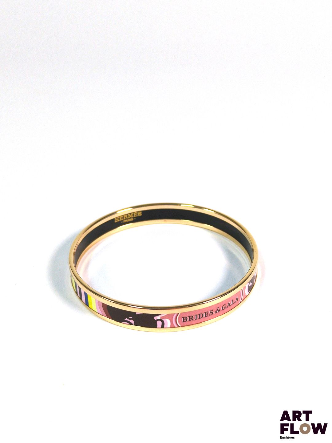HERMES Modèle brides de gala Bracelet en plaqué or rose et émail. Diamètre : 6 cm Dans son pochon et sa boîte d'origine