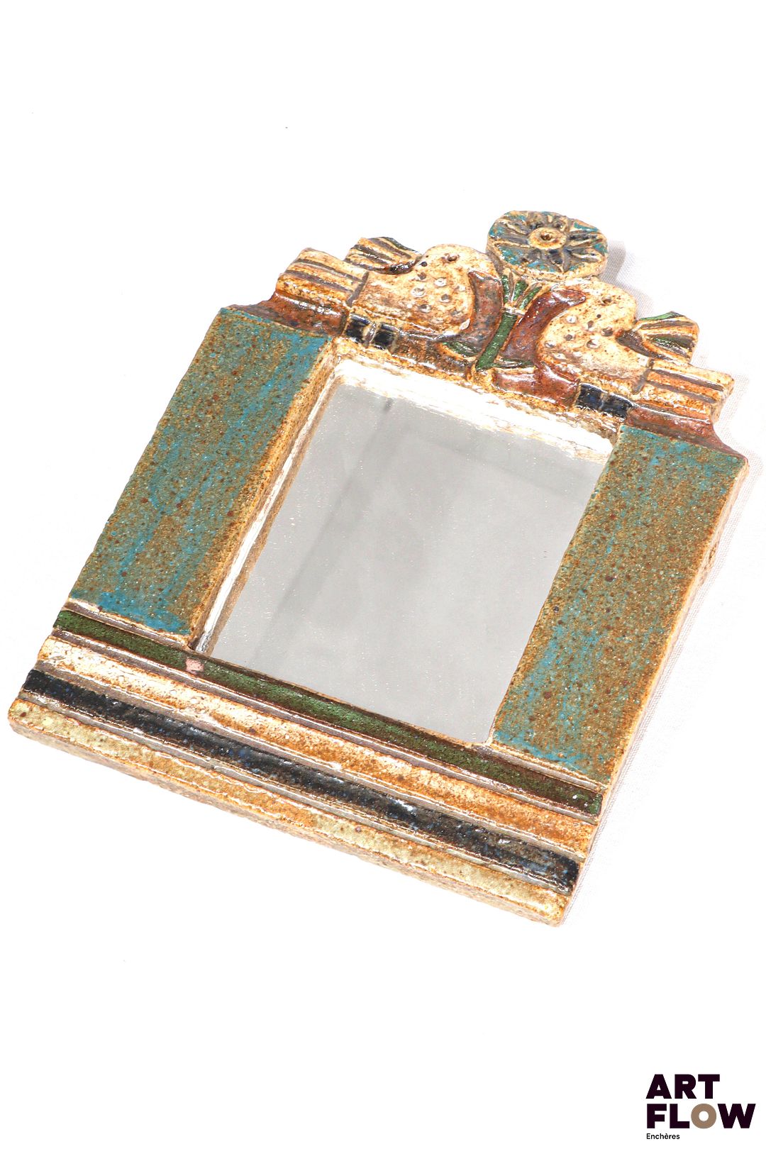 LES ARGONAUTES - Vallauris - Miroir en céramique émaillée polychrome à motifs de fleurs et d'oiseaux - signé au revers "les argonautes Vallauris" H. 25,5 x L. 18 cm