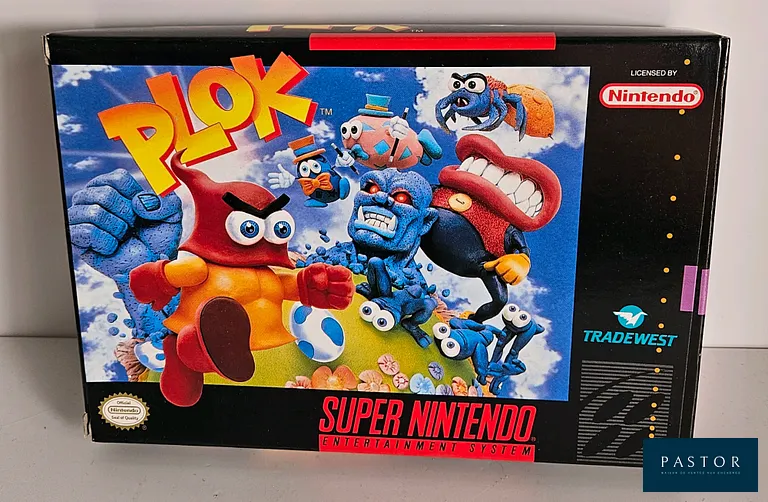 NINTENDO - SUPER NES. Jeu : Plok. Complet avec boite, notice et cartouche. Version US. TBE. Etat proche du neuf. Sortie : 1993. Plateforme 2D