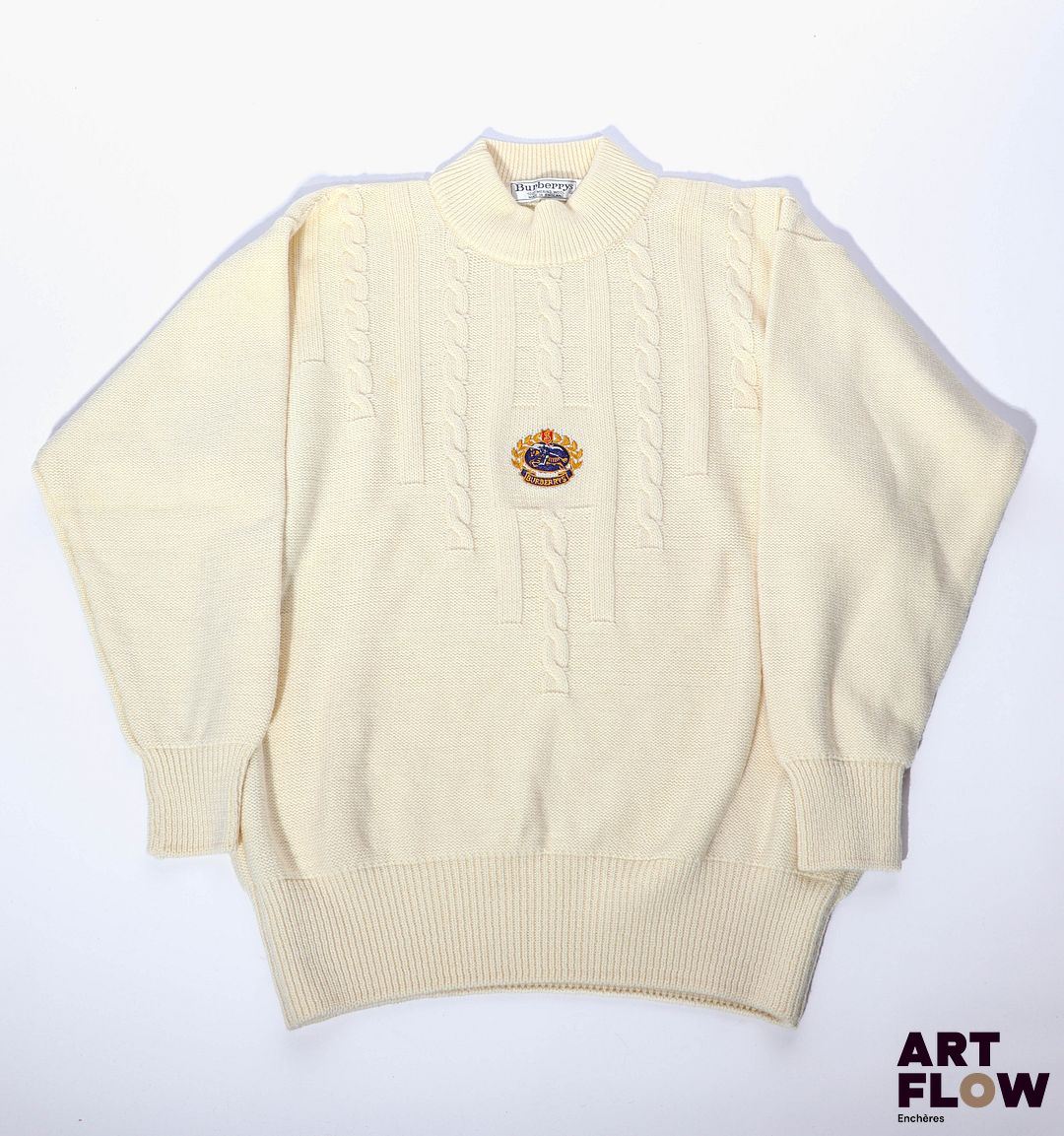 BURBERRY'S Pull en laine merinos de couleur crème à décor de torsades et blason brodé au centre Taille 42