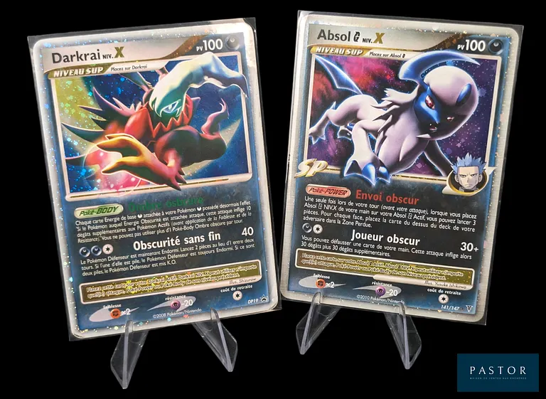 Réunion de 2 cartes Pokémon - Niv.X.
- Absol 141/147 - Rare - Série du bloc Platine : Vainqueurs Suprêmes.
- Darkrai DP19 - Promotionnelle du bloc Diamant&Perle.
Cartes en état global Excellent, en français.
Livrées sous bulles et toploaders.