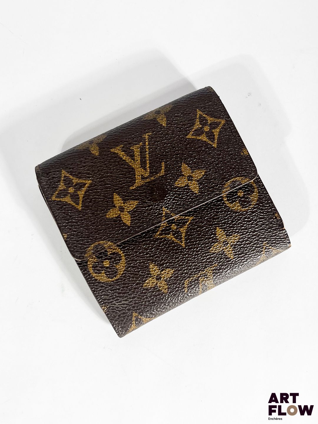 LOUIS VUITTON Porte-feuille porte-monnaie en toile Monogram Dimensions : 10 x 11 cm env. En l'état (usures et accidents, notamment internes)
